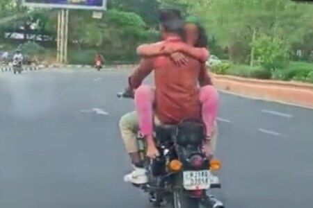 WATCH: Royal Enfield Bullet 350 Rider Romances Girlfriend On His Bike